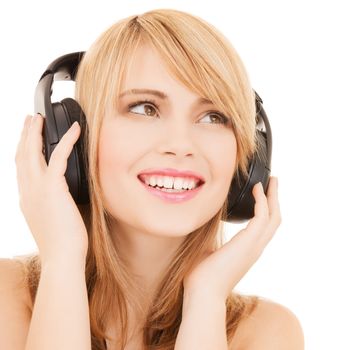 music and entertainment concept - happy girl with headphones