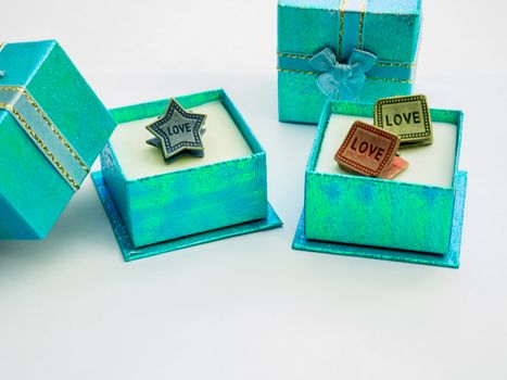 Small gift boxes is beautiful colors and cute paper clips.