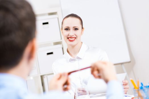 business woman holding an interview with a man in the office