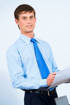 image of a businessman in the office with business papers