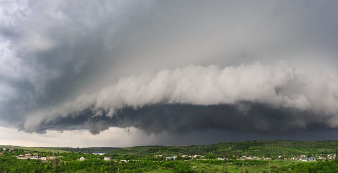 Beginning of the storm, cold weather front covers the village. Panorama stitched from 4 mages.