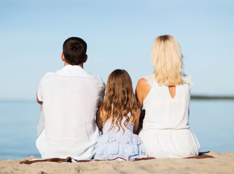 summer holidays, celebration, children and people concept - happy family at the seaside