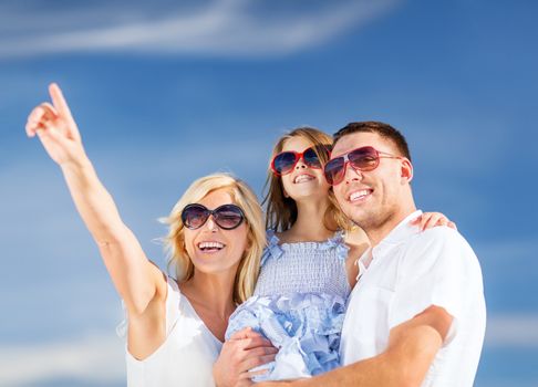 summer holidays, children and people concept - happy family with blue sky