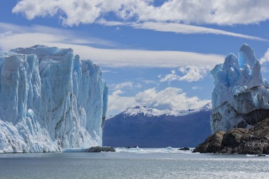 Patagonia, Perito Moreno blue glacier. View from lake boat. Watching the high blue ice block