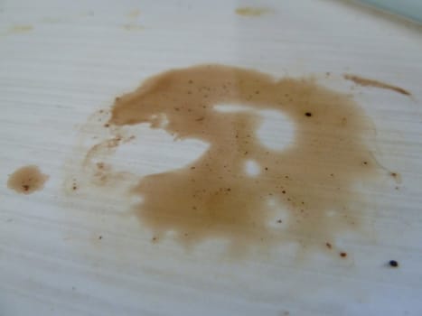 Coffee spill on a white surface