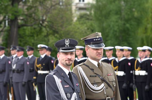 Warsaw, Poland – May 12, 2014: Danish Crown Prince Couple on state visit to Poland. Polish soldiers line up for a parade.