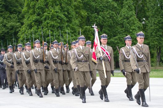 Warsaw, Poland – May 12, 2014: Danish Crown Prince Couple on state visit to Poland. Polish soldiers at the military parade.