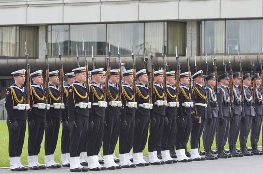 Warsaw, Poland – May 12, 2014: Danish Crown Prince Couple on state visit to Poland. Polish soldiers line up for a parade.