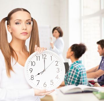education and time management concept - attractive student showing clock