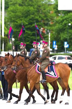 Warsaw, Poland – May 12, 2014: Danish Crown Prince Couple on state visit to Poland. Polish cavalrymen at the military parade.