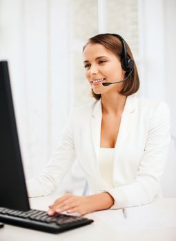 business, communication and call center concept - friendly female helpline operator with headphones