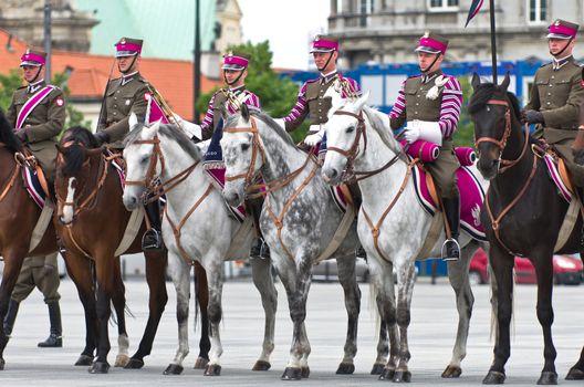 Warsaw, Poland – May 12, 2014: Danish Crown Prince Couple on state visit to Poland. Polish cavalrymen at the military parade.