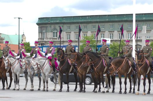 Warsaw, Poland – May 12, 2014: Danish Crown Prince Couple on state visit to Poland. Polish cavalrymen at the military parade.