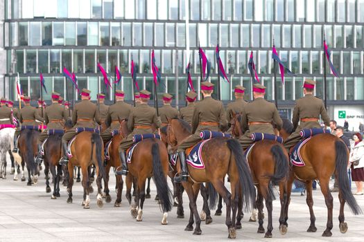 Warsaw, Poland – May 12, 2014: Danish Crown Prince Couple on state visit to Poland. Polish cavalrymen at the military parade.