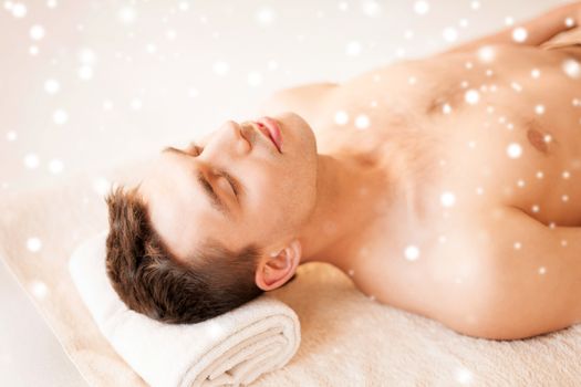 health and beauty concept - man in spa salon