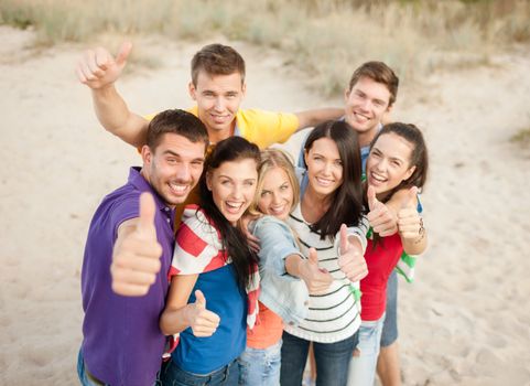 summer, holidays, vacation, happy people concept - group of friends having fun on the beach