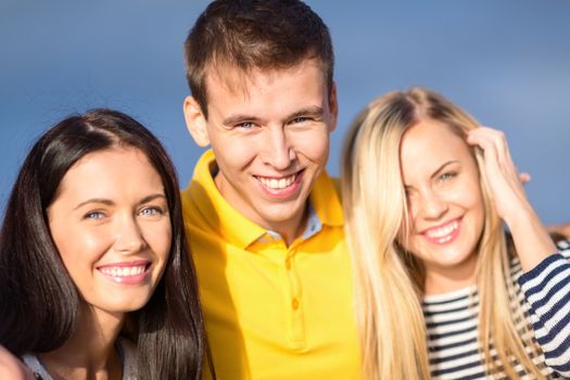 summer, holidays, vacation, happy people concept - group of friends having fun on the beach