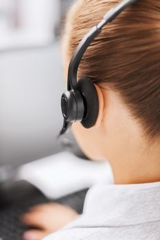 business, office, school and education concept - female helpline operator with headphones