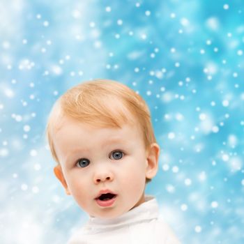 winter, people, x-mas, christmas, happiness concept - - happy little boy in winter clothes