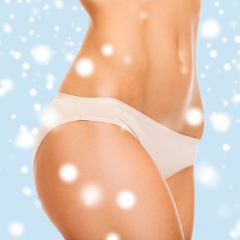 health and beauty - woman in cotton underwear showing slimming concept