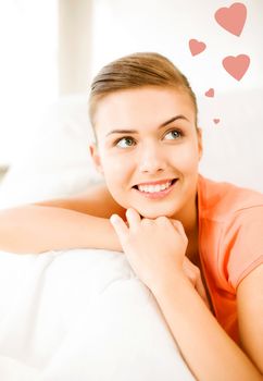 picture of happy woman in love dreaming at home