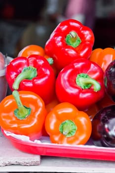 Photo of five fresh red raw pepper