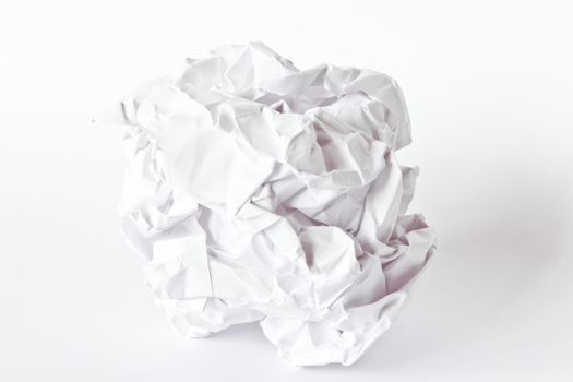Photo of crumpled paper ball on white background