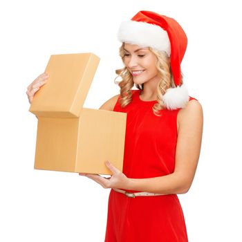 christmas, x-mas, winter, happiness concept - smiling woman in santa helper hat with gift box