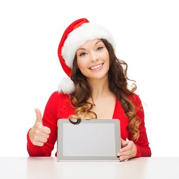 christmas, x-mas, electronics, gadget concept - smiling woman in santa helper hat with blank screen tablet pc