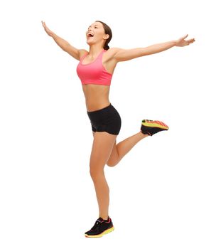 fitness, sport, training, exercise, gym and lifestyle concept - beautiful sporty woman running or jumping