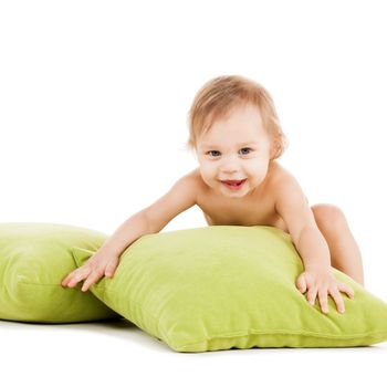 childhood and toys concept - cute little boy playing with green pillows