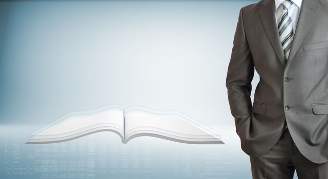 Businessman standing with hands in pockets. On background of the open book and high-tech graphs