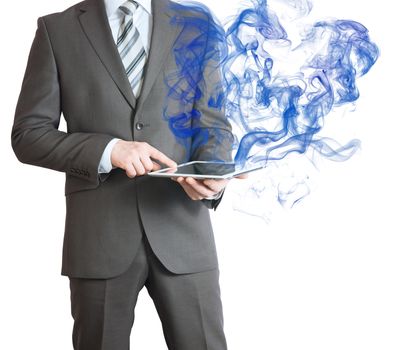 Businessman in a suit holds tablet pc with smoke. The technology concept