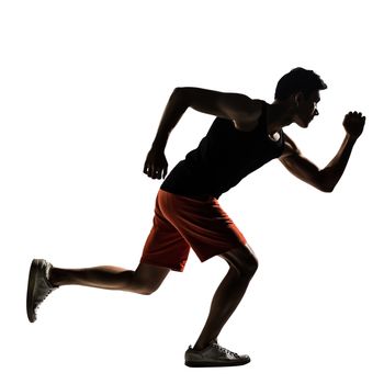 Silhouette of young Asian athlete running, full length portrait isolated on white.