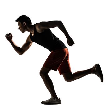 Silhouette of young Asian athlete running, full length portrait isolated on white.