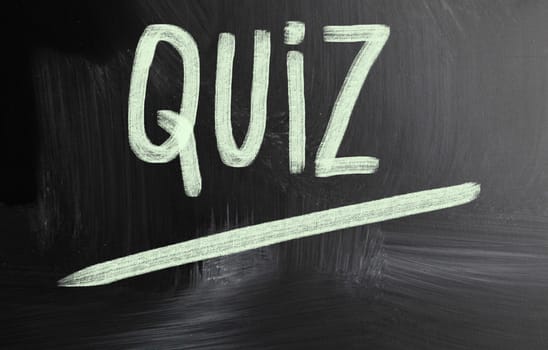 quiz handwritten with chalk on a blackboard
