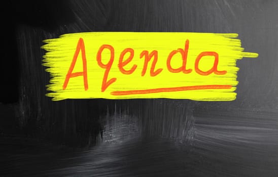agenda handwritten with chalk on a blackboard
