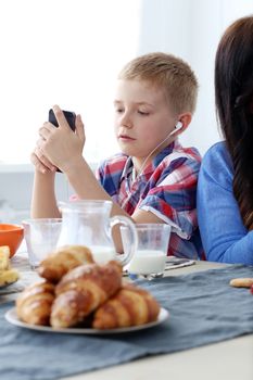 Mother with kid during family breakfast