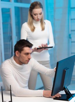 business, internet, technology, computers, science communication concept - woman and man with computer in the lab