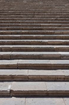 Old damaged stone staircase, up and down, textured background