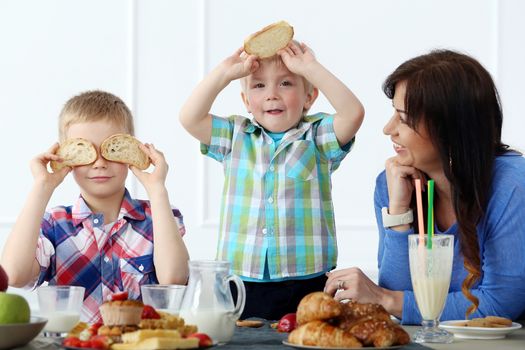 Mother and two brothers during family breakfast