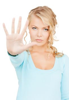 business, communication concept - bright picture of young woman making stop gesture