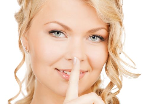 business, communication concept - picture of mysterious woman with finger on her lips