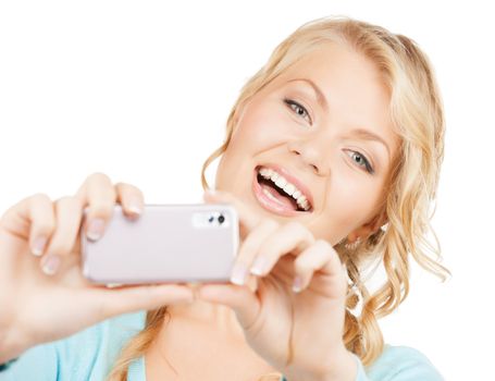 technology concept - smiling woman taking photo with smartphone