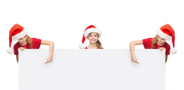 christmas, x-mas, people, advertisement, sale concept - girlsn in santa helper hats with blank white board