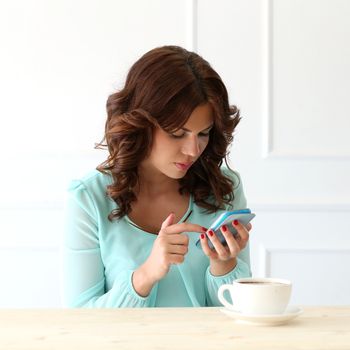 Cute, attractive woman in the cafe