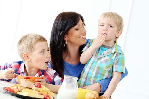 Mother and two brothers during family breakfast