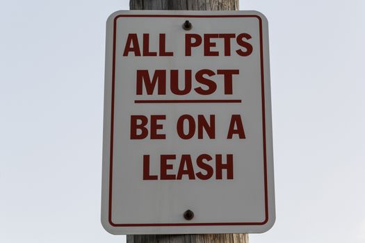 All pets must be on a leash red and white sign. 