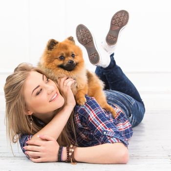 Cute, attractive girl with fluffy dog