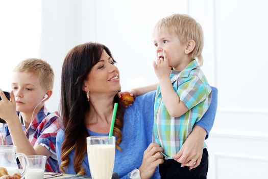 Mother and two brothers during family breakfast